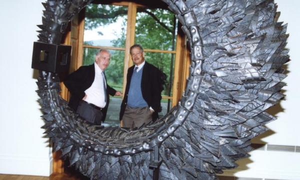 David Collens and H. Peter Stern with a sculpture by Chakaia Booker, 2003. 