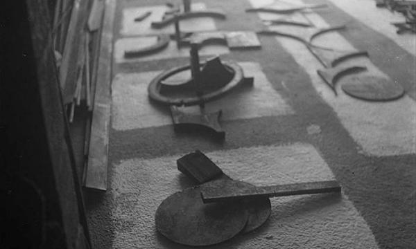 Elements for <em>Albany I</em> (1959) and other sculptures laid out for assembly on the floor of David Smith&#39;s workshop in Bolton Landing, NY, c. 1959